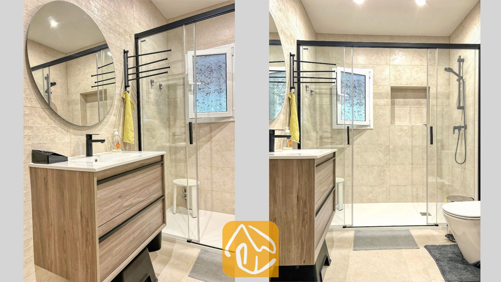 Vakantievilla's Costa Brava Spanje - Villa Iako - Moderne badkamer met een inloopdouche met glazen deur, een houten badkamermeubel met een witte wasbak en een ronde wandspiegel tegen neutraal beige tegelmuren.