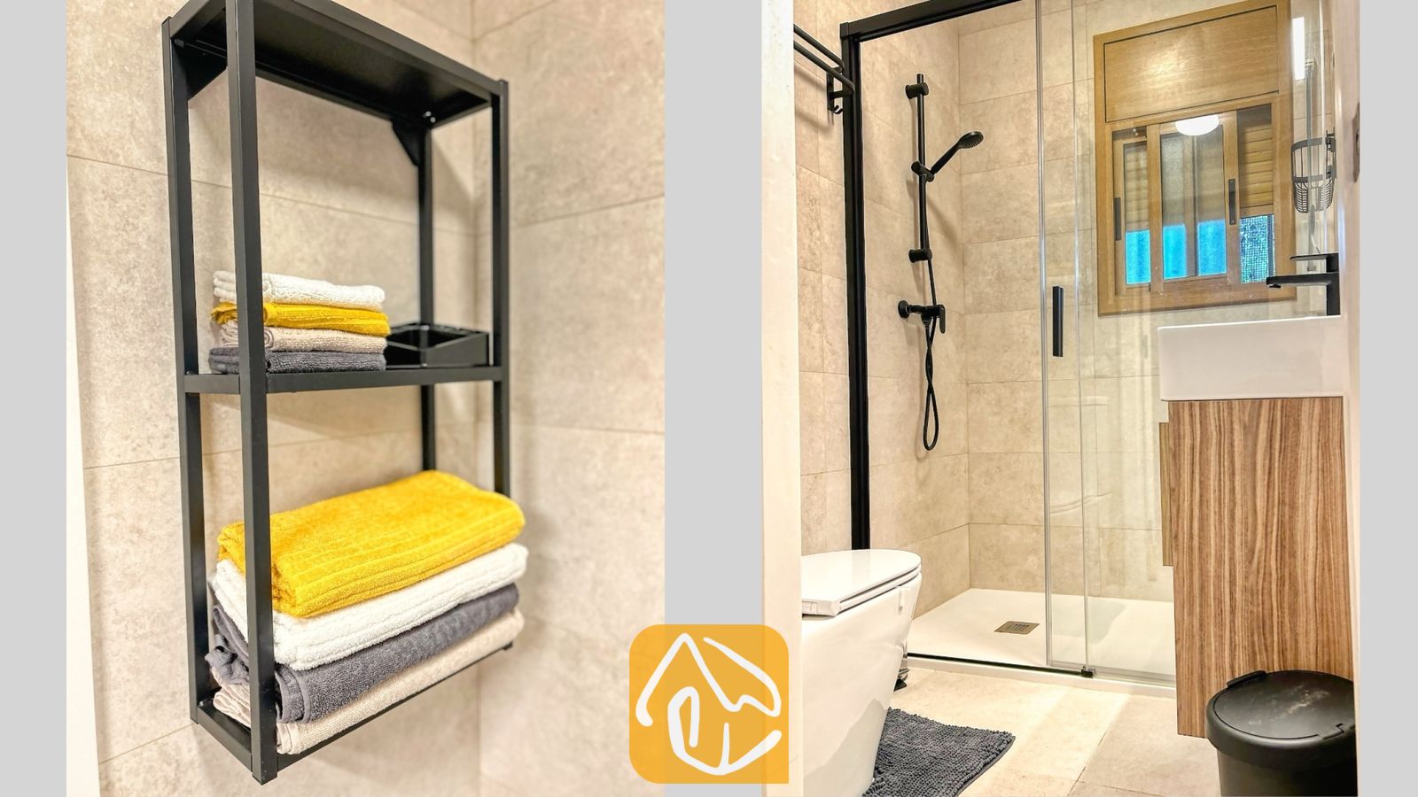 Vakantievilla's Costa Brava Spanje - Villa Iako - Moderne badkamer met beige betegelde muren, een zwart metalen wandrek gevuld met opgevouwen handdoeken, een inloopdouche met een zwart frame en een houten badkamermeubel.